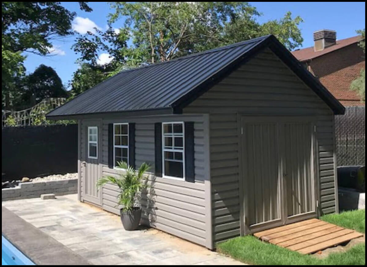 Backyard Shed with Garage Door, Side Door, Windows, and Black Metal Roof