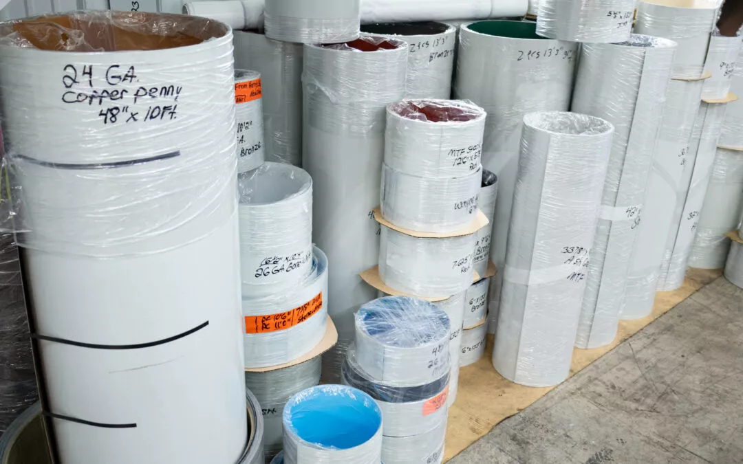 Martin's Trim Forming Millmont, PA Various rolls of metal trim labeled with different sizes and specifications are stacked vertically and horizontally on the floor of a workshop.