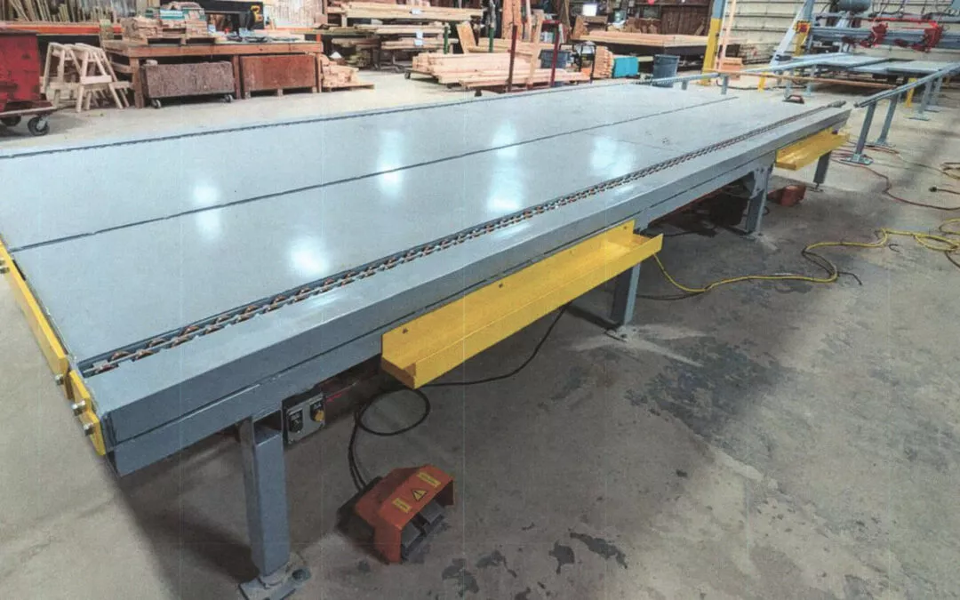 Midstate Lamp LLC Arthur Illinois Long industrial conveyor belt system inside a factory, surrounded by various machinery.