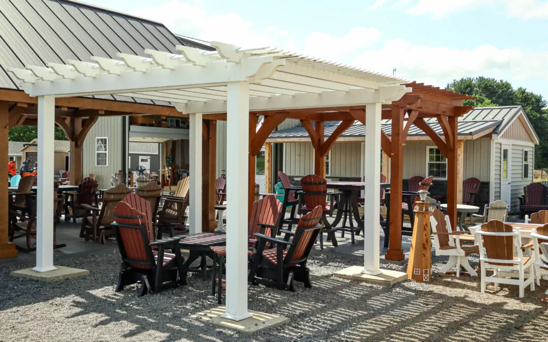 Summit Structures & Outdoor Living Greenville, PA Outdoor shopping area under wooden pergolas with various tables and chairs for sale.