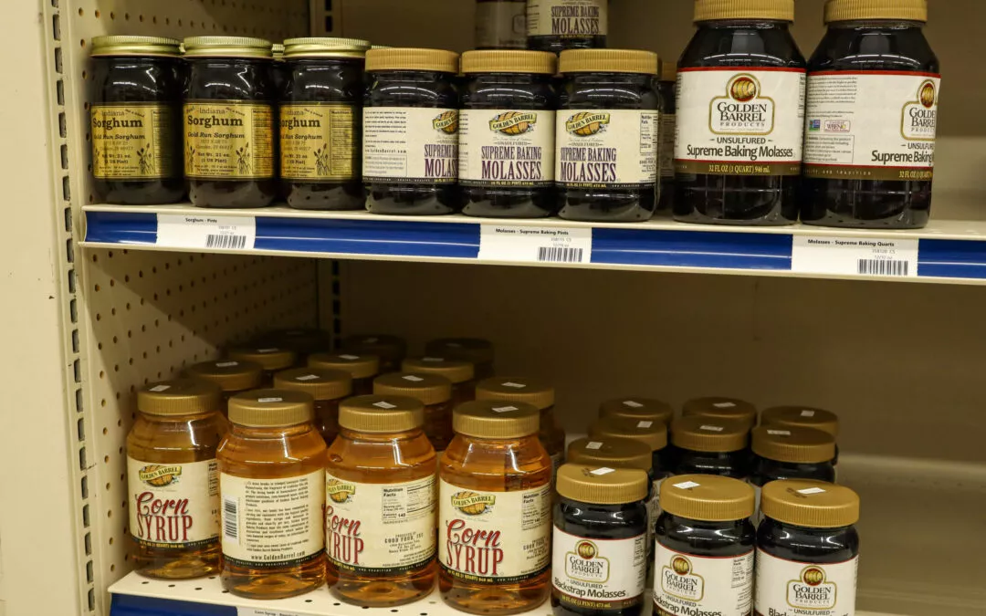 Lakeside Country Store Mishicot, Wisconsin Jars of different types of molasses and corn syrup are neatly arranged on store shelves.
