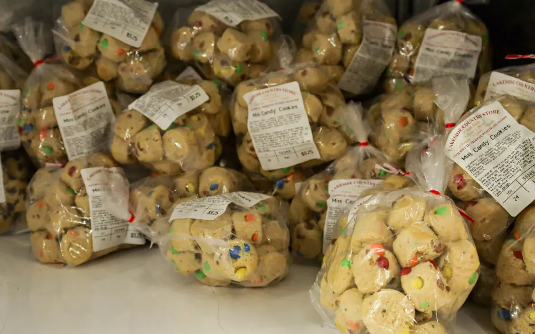 Lakeside Country Store Mishicot, Wisconsin Bags of M&M candy cookies piled on a shelf. Each bag is labeled with ingredients and pricing information.