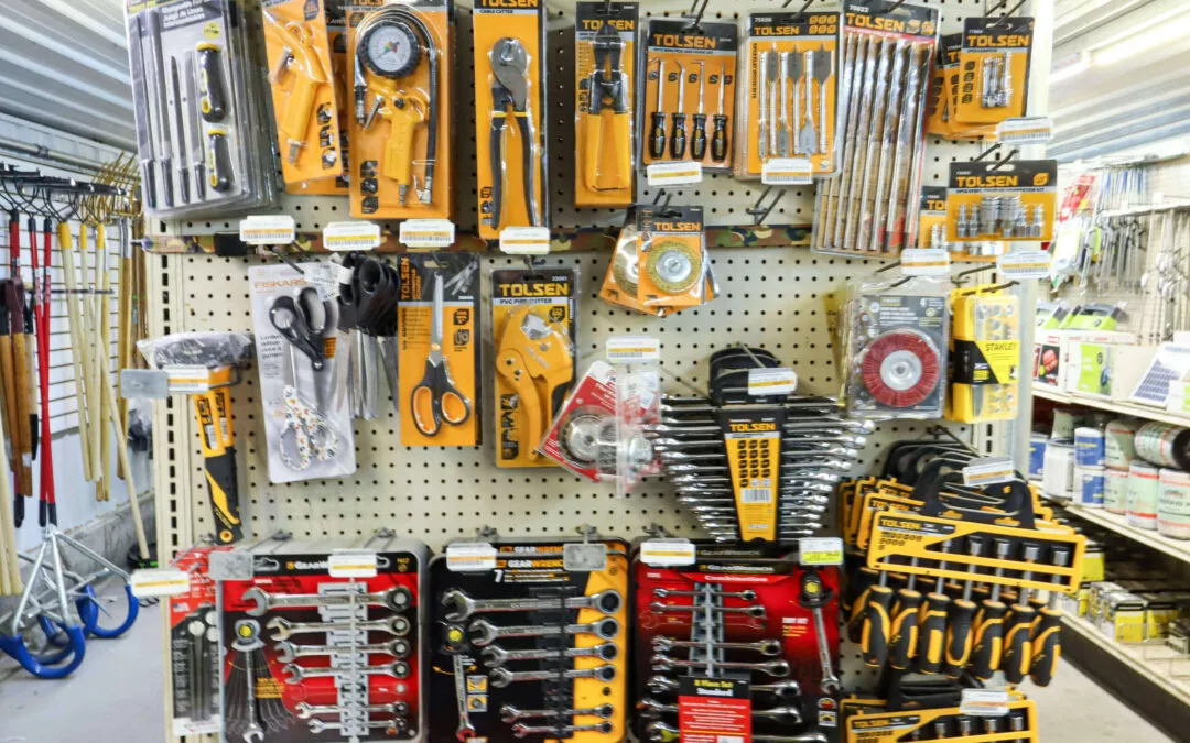 Chippewa Vallaey Dairy Supply Stanley, WI A display shelf in a store with various packaged hand tools, including wrenches, screwdrivers, and measuring tapes.
