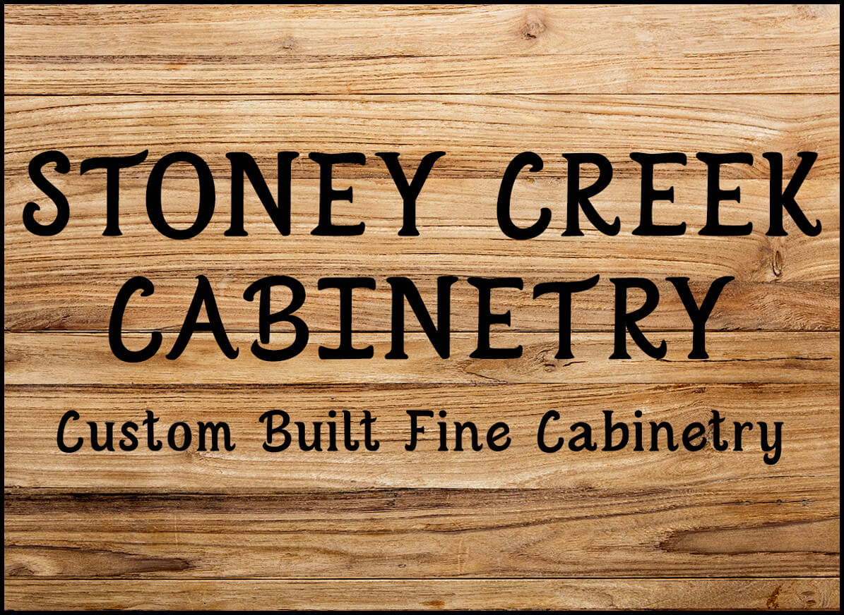 8.20.23 Stoney Creek Furniture JPB Summary Graphic Small A wooden sign displays the text "STONEY CREEK CABINETRY Custom Built Fine Cabinetry" in black letters.