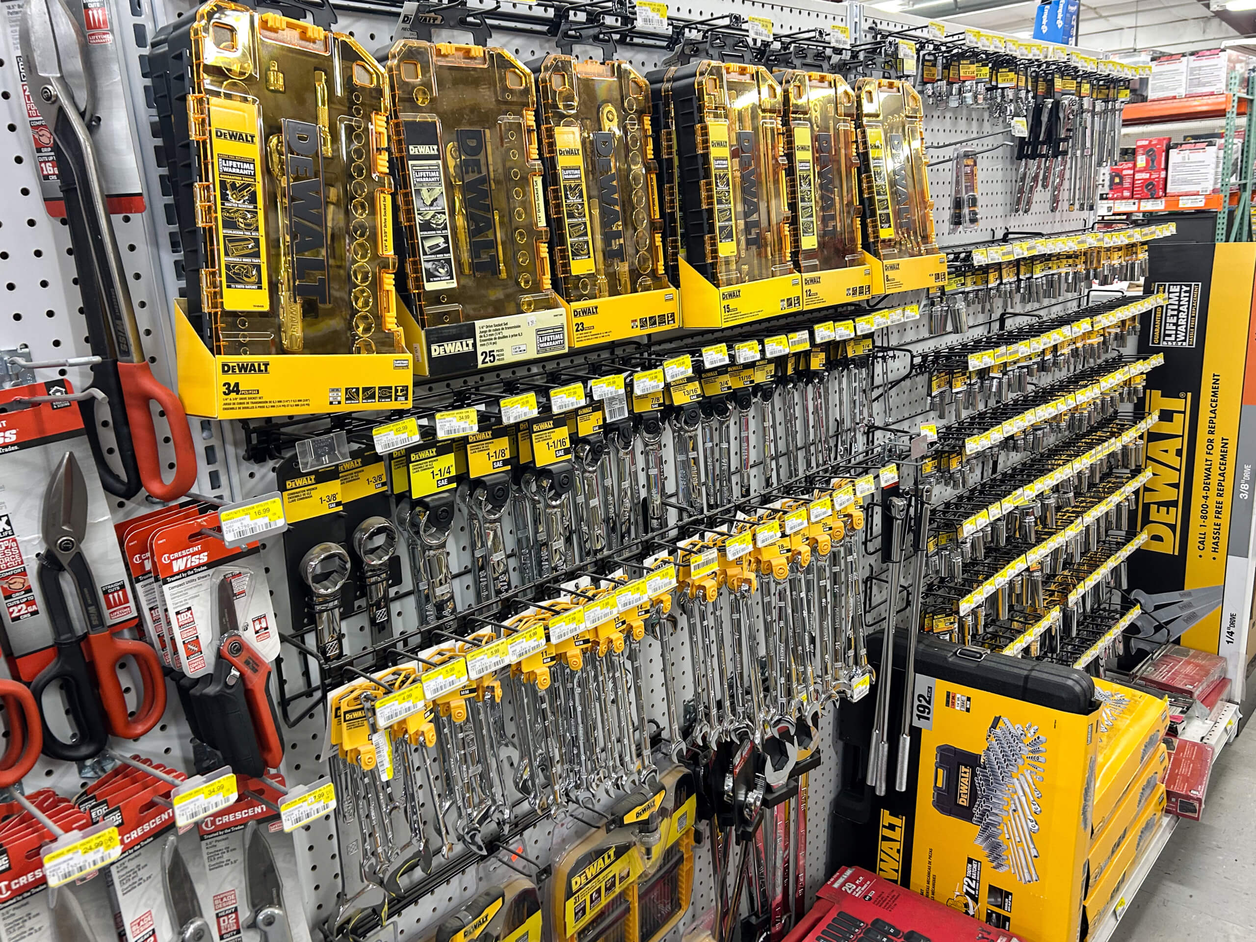 Benny's Hardware Barnett MO A store shelf displays various Dewalt hand tools, including wrenches and ratchets, organized in rows with yellow packaging and price tags visible.