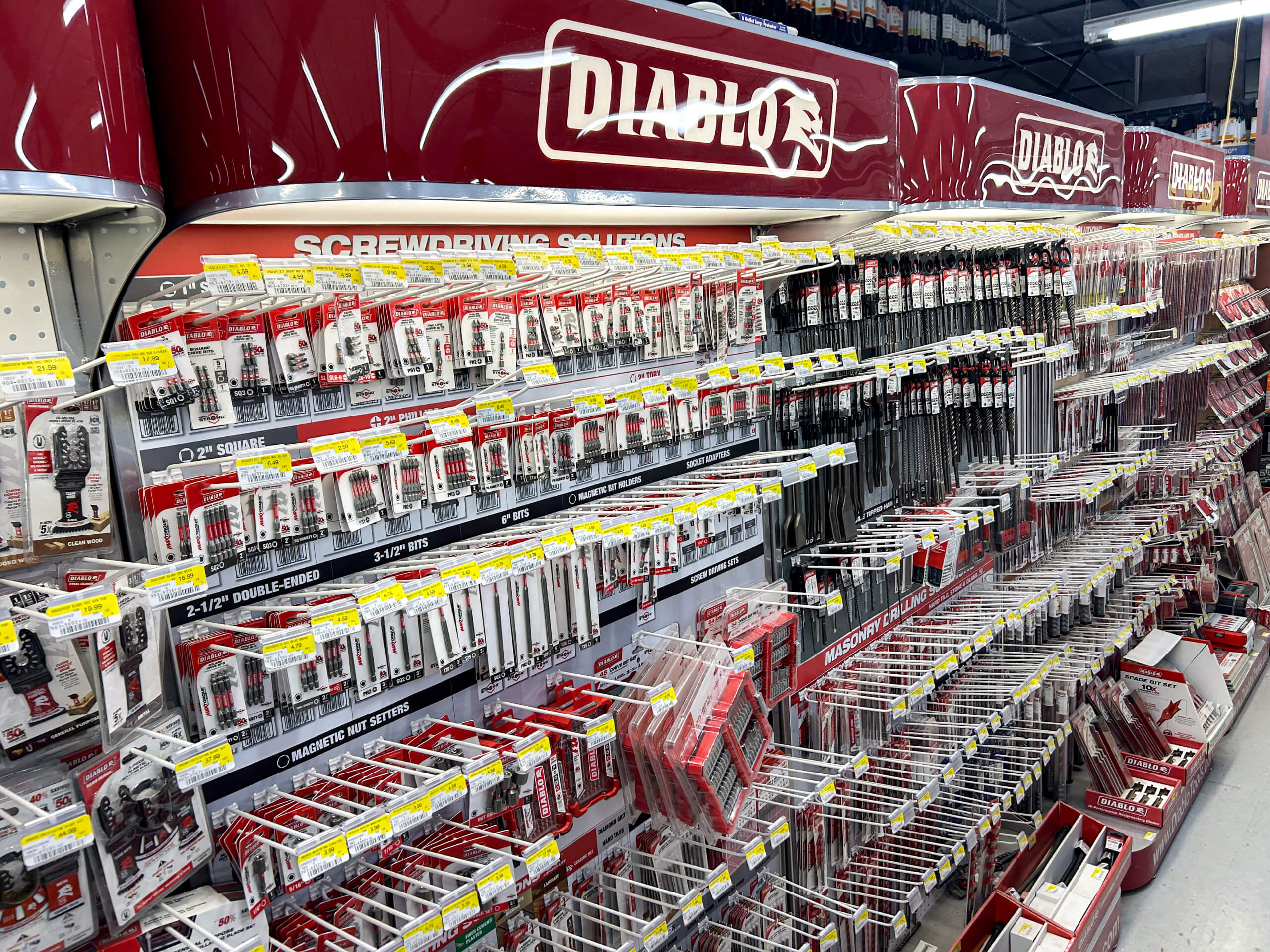 Benny's Hardware Barnett MO A store aisle displays various Diablo brand screwdriver bits and accessories in organized rows on hooks and shelves, with red and white packaging under labeled signage.