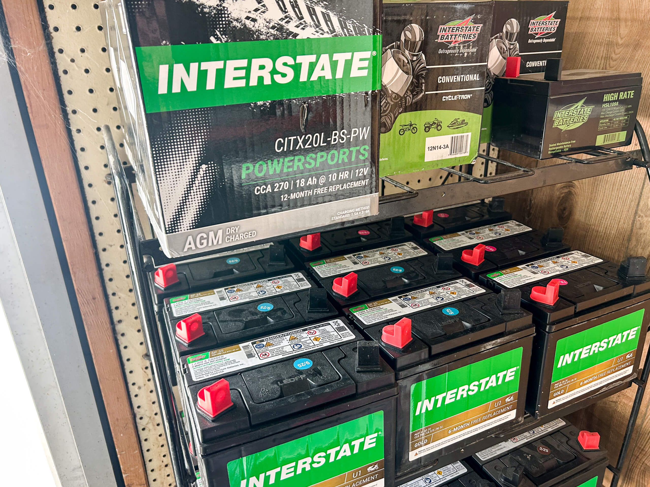 11.4.25 AK Small Engines Gallery 2-5 several interstate batteries on a shelf