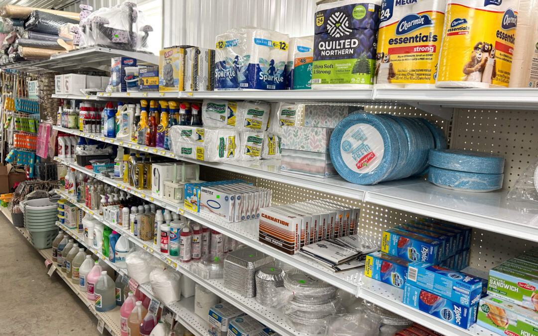 Shetler's Supplies Hardware Variety Bulk Foods Greenville PA Store shelves stocked with household paper products, cleaning supplies, disposable plates, cups, foil pans, and other assorted household goods.