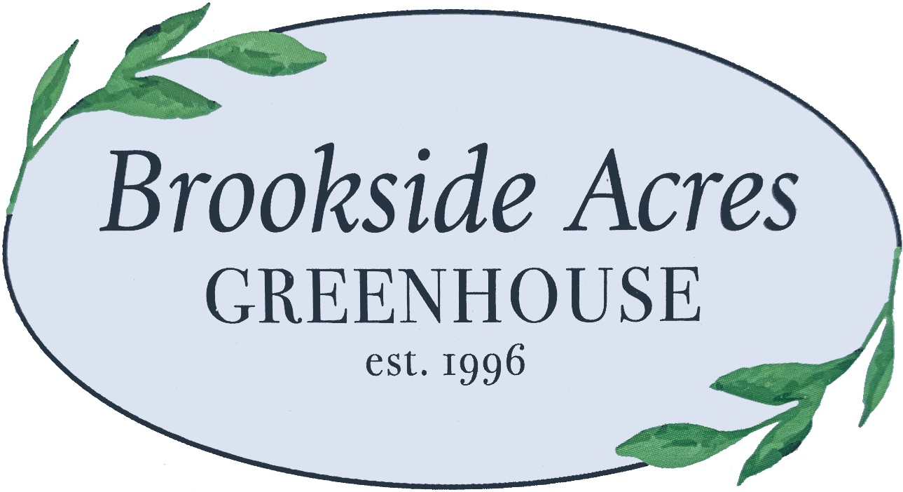 An oval sign reads "Brookside Acres Greenhouse est. 1996" with green leaves decorating the top left and bottom right corners.