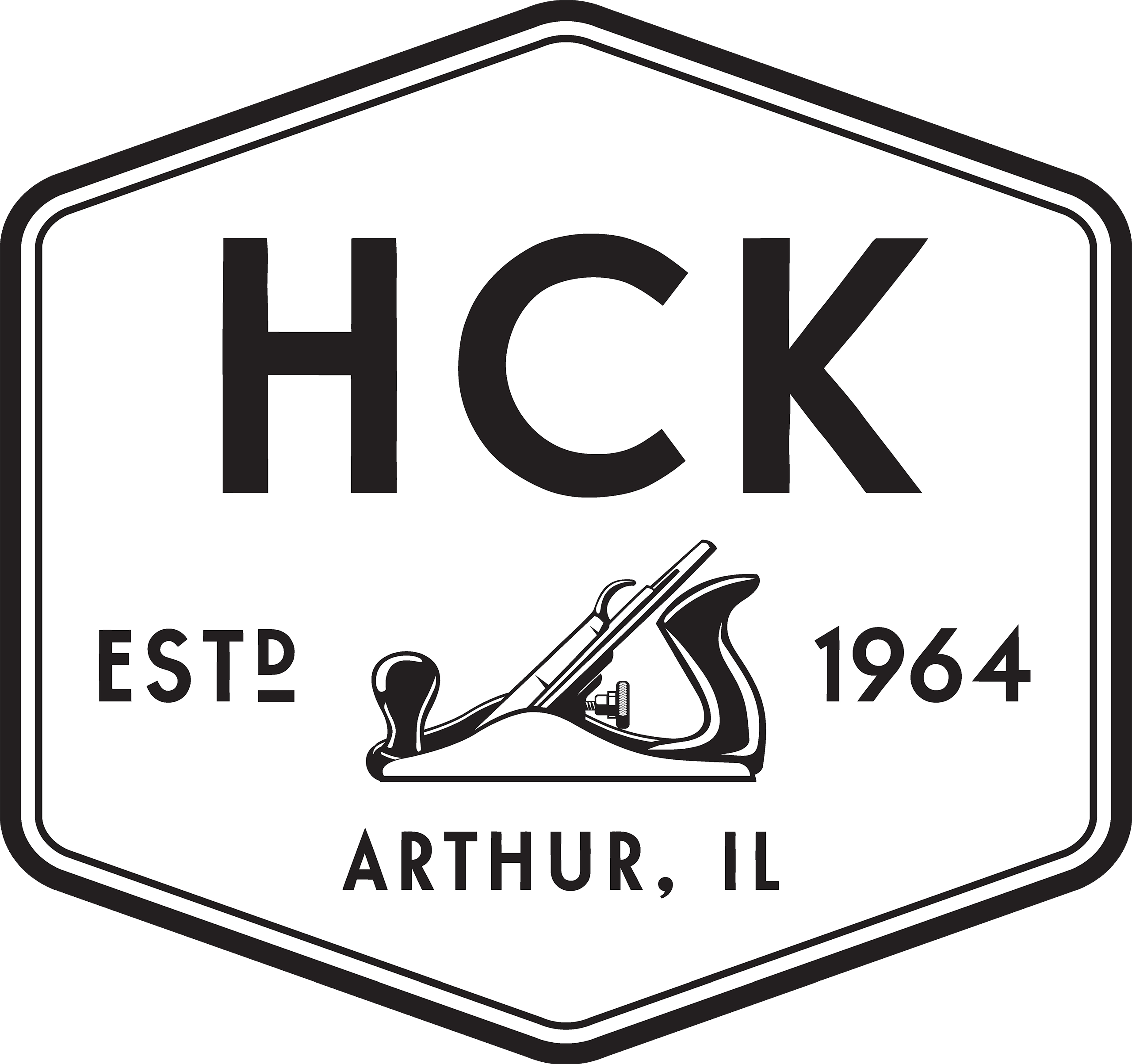 Black and white hexagonal logo with "HCK" at the top, a hand planer illustration in the center, and the text "ESTD 1964" and "ARTHUR, IL" below.