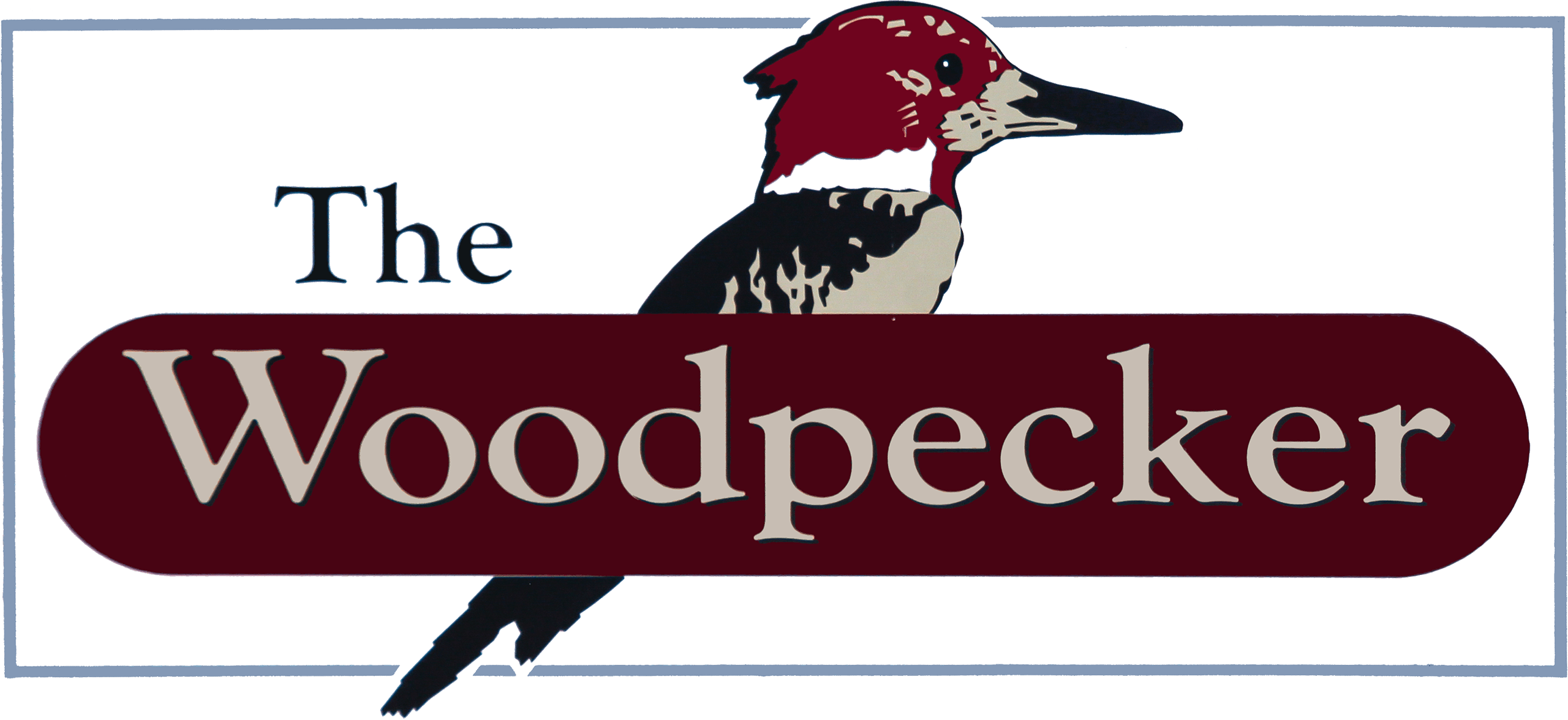 Logo with the text "The Woodpecker" over a maroon banner, featuring an illustrated woodpecker bird in the background.