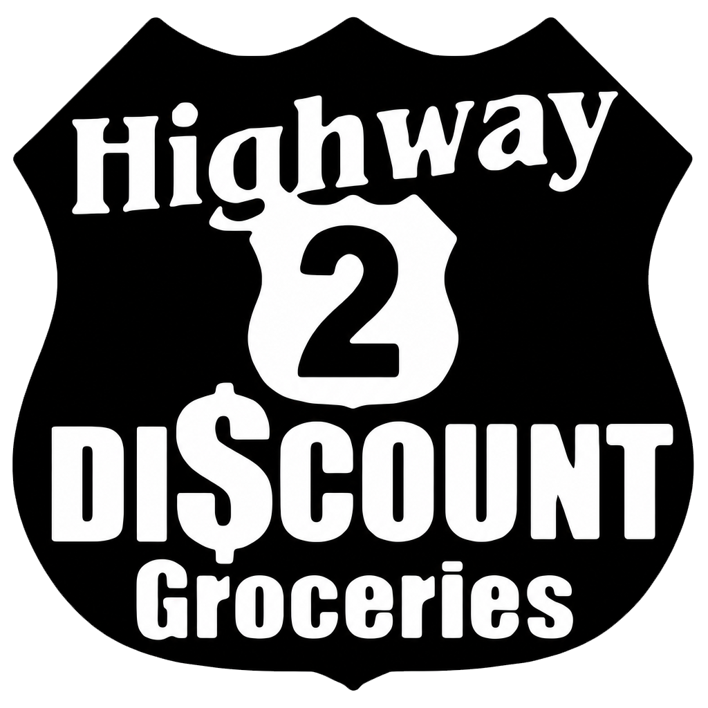 A black and white shield-shaped sign reads "Highway 2 Discount Groceries" with a dollar sign replacing the "S" in "Discount.