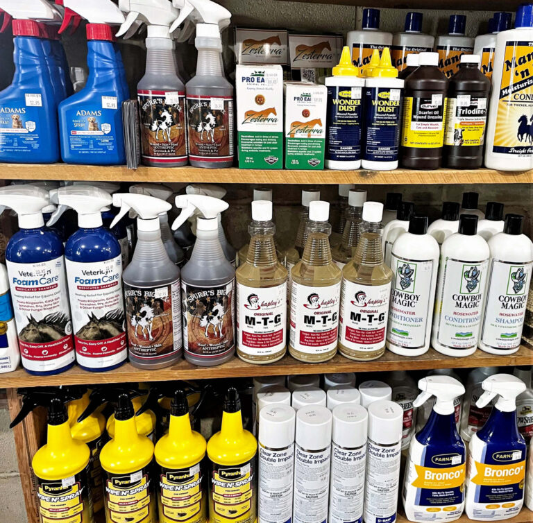 7.20.26 PenchemPenchem Tack Store Guthrie, KY Tack Store Gallery 2-11 Shelves stocked with various animal grooming and care products, including sprays, shampoos, conditioners, and ointments in bottles and cans, arranged by type and brand.